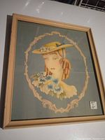 Front view of framed artwork showing subject and frame