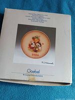 Front of Goebel box with image of plate and 1986 label