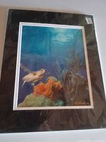 Front view showing entire matted art print in plastic sleeve