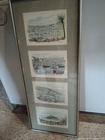 Full view of vertical frame showing four prints