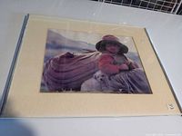 Front view showing artwork, mat, and damaged metal frame