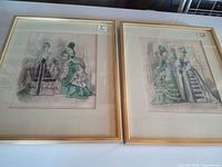 Both framed lithographs side by side showing overall look