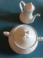 Soup tureen with lid and teapot with lid displayed