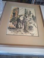 Full view of framed artwork showing image, matting, frame