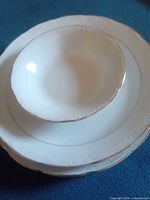 Stacked view of plates and bowl showing size and design