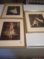 All three framed ballerina prints grouped on flat surface