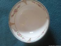 Top view of bowl showing interior floral pattern and gold accents