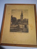 Front view of framed print showing image, frame and water stains