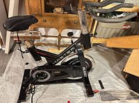 Full side view of Bladez Master G5 spin bike showing frame, flywheel, seat and handlebars