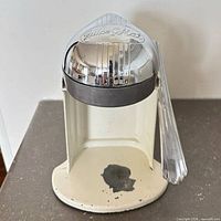 Front view showing Juice-O-Mat logo on chrome dome, interior reamer, paint loss on base