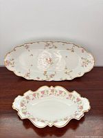 Two Limoges porcelain serving pieces showing size difference and pattern