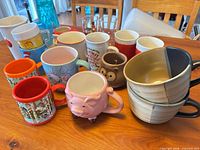 Group shot of assorted mugs, tumblers and cups