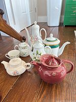Group shot of all seven items on wood floor