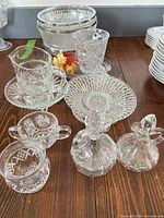 Group view of pressed and cut glass pieces on table