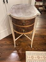 Full view of demi-lune side table showing finish and leg structure