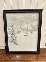 Front view of framed winter landscape print showing image details and black frame