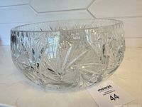 Side view of clear cut crystal bowl showing starburst cut pattern
