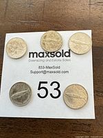 Five 1967 Canadian 10-cent coins on MaxSold slip