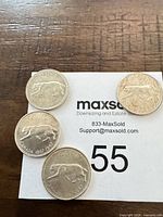 Four 1967 Centennial quarters on lot card