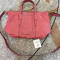 Front view of Fossil burgundy tote with shoulder strap shown