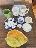 All eight ceramic pieces displayed together on table