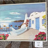 Front view of white-framed coastal print