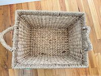 top view of rectangular woven basket interior and handles