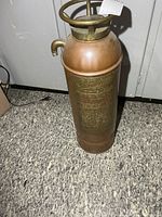 Full view of extinguisher showing body and height