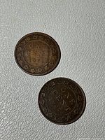 Both Canadian large cents showing reverse sides with ONE CENT dates 1876 and 1907