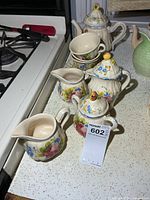 Full view of Italian floral tea set on countertop