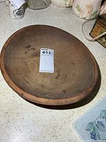 Top view of wooden bowl showing interior surface and diameter scale