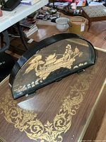 Full view of cork diorama in arch glass case on stand