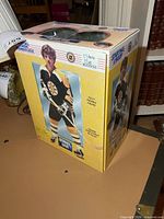 Front/right side of boxed Bobby Orr figure