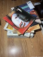 Stack of various books showing several visible titles