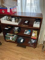 Front view of three-shelf bookcase with contents shown for scale (contents excluded)