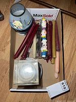 Overview of tray with assorted candles and glass holder