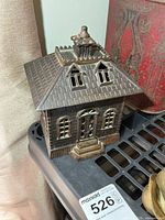 Front angled view of cast iron State Bank coin bank