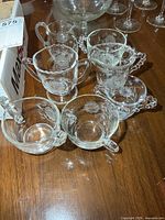 Group of six Cornflower pattern glass pieces on table
