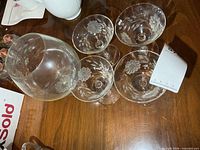 Top view of one large pedestal vase and four martini glasses showing Cornflower pattern