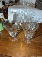 Five Cornflower etched dessert glasses grouped on table
