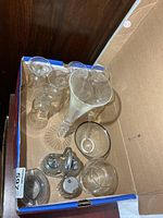 Box containing seven dessert glasses, Waterford flute, condiment bowl, salt & pepper set in chrome stand