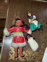 Group shot of all three vintage dolls displayed on wood surface