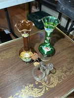 Amber and green enamelled vases with clear twisted bud vase