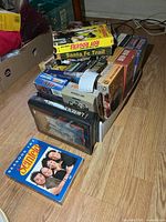 Box filled with VHS tapes and Seinfeld DVD sets