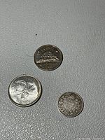 Group shot of the three Canadian coins (1913 dime, 1968 quarter, 1962 nickel)