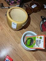 tan and white ceramic planters with packaged hanger