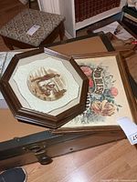 Overall view of both framed pieces stacked on trunk