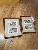 Two wood frames each holding two countryside prints
