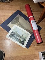 London color print, sepia matted print, red tube containing rolled print