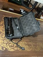 flashlight in open foam-padded case